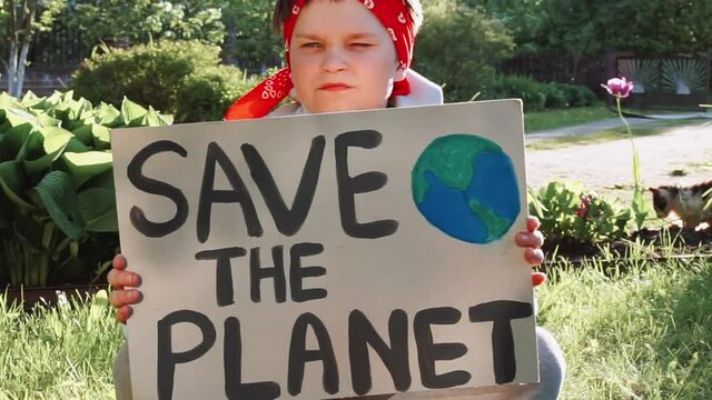 demonstration against global warming and pollution. Child boy making protest about climate change, plastic problems, global warming, pollution. Save the planet poster. Climate Strike. Eco Activism .