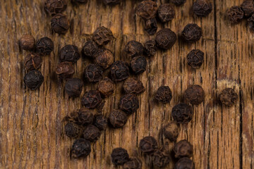 black pepper on wooden table