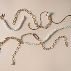 Women's jewelry and other stuff on a neutral background