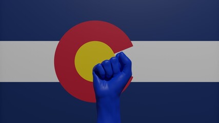 A single raised blue fist in the center in front of the US state flag of Colorado