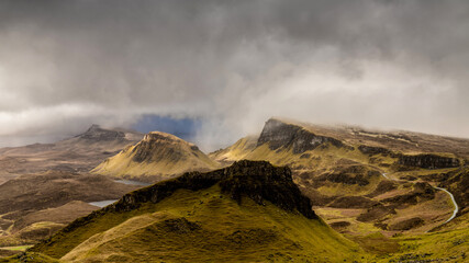 Dramatic landscape Isle of Skye, part of the Scottish Highlands and Islands, iconic and famous landmark of the Quirang during a morning storm and weather front
