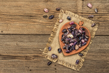 Assorted multicolored beans in a ceramic bowl