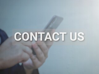 Text contact us with blurry background.