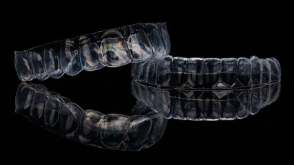 Silicone Dental Kappa, composition on black glass with reflection