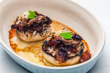 champignongs stuffed with onion and dry tomatoes
