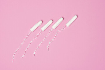 hygienic feminine tampons for menstruation on a pink background