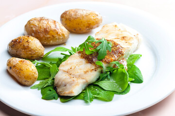 grilled carp with mustard sauce and grilled potatoes