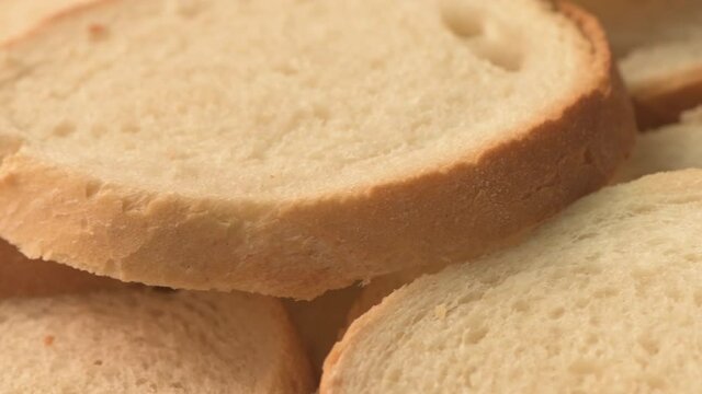 Slices of white bread on turning plate, close up