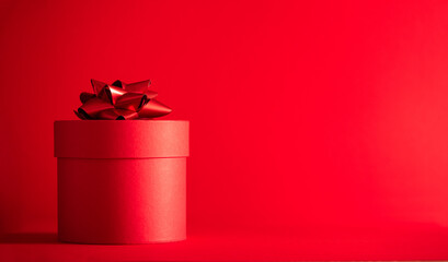 merry christmas and happy new year. the concept of black friday. red gift box with gold bow on red...