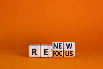 Refocus and renew symbol. Businessman turned cubes and changed the word 'refocus' to 'renew'....