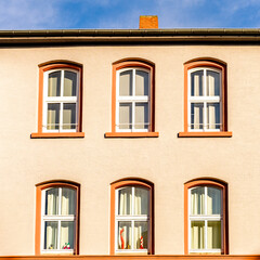 facade of an house with windows near Frankfurt Hauptbahnhof in a sunny morning and blue sky