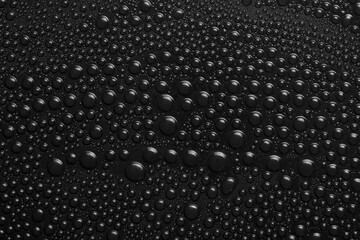 Water drops on black background texture. Dark backdrop glass covered with drops of water. black bubbles in water