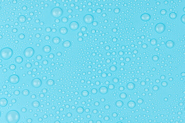 Naklejka na ściany i meble Water drops on blue background texture. Backdrop glass covered with drops of water. bubbles in water