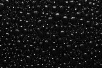 Water drops on black background texture. Dark backdrop glass covered with drops of water. black bubbles in water