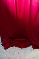 Red fabric in the light and white floor