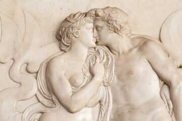 Fototapeta na wymiar Ancient sculpture with kissing couple, Florence - Italy