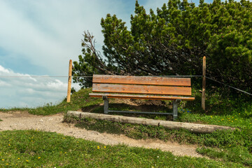 Sareis, Liechtenstein, June 20, 2021 Empty bench in the alps