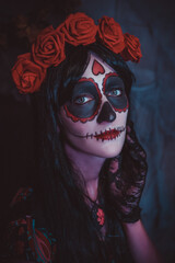 Beautiful woman with colored makeup closeup. Halloween mexican cosplay