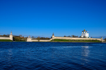 Flat and High towers. Historic site in Pskov. Fortress wall. Pskov Krom. sunny day.