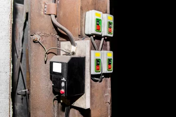 Fotobehang Automatic old electrical box with start buttons control panel © Andrey