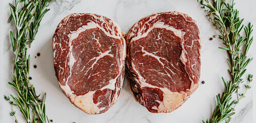 aged black angus beef steak ready to roast and serve.