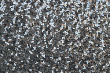 shiny round silver sequins pattern - closeup background texture for festive events and galas