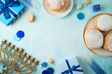 Frame border design for Jewish holiday Hanukkah with traditional donuts, menorah and gift box. Top...