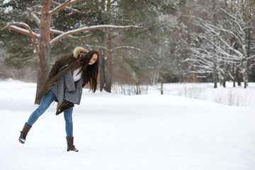 Beautiful girl in a beautiful winter park