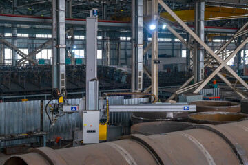 Naklejka premium Submerged welding. Automatic welding. Automated pipe welding process by welding column.