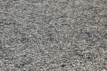 Gravel on the path. Gray stones. Gravel used in making th walk sidewalk