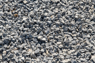 Gravel on the path. Gray stones. Gravel used in making th walk sidewalk