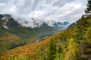 Panoramic view over the colorful valley of Jacques-Cartier river at Fall, Quebec, Canada