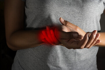 Female suffering with wrist pain.