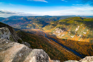 Vibrant colored foliage at the edge of the valley of Hautes-Gorges national park and Malbaie river, Quebec, Canada