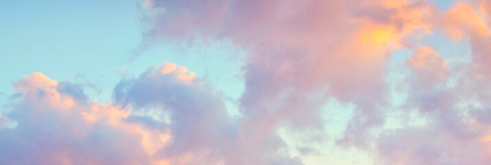 Clear blue sky, red, pink, golden cirrus and cumulus clouds after storm. Dramatic sunset...