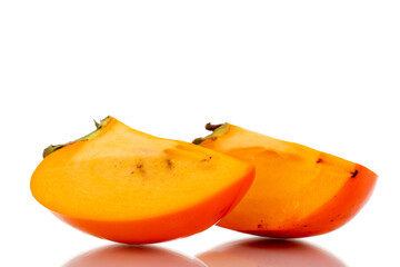 Two slices of sweet organic persimmon, close-up, isolated on white.