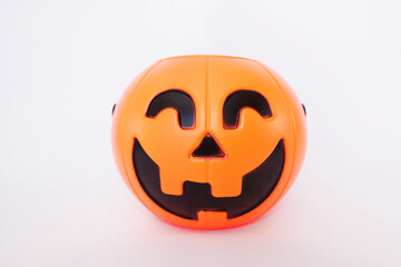 Halloween pumpkin bucket isolated on white background (clipping path) for kid collecting candy in Jack o'lantern basket,