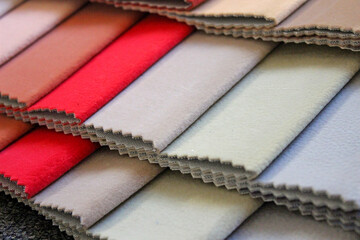 Samples of colorful upholstery fabrics. Various texture and colors