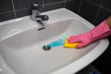 Washbasin disinfection with detergent. The concept of cleanliness and safety at home