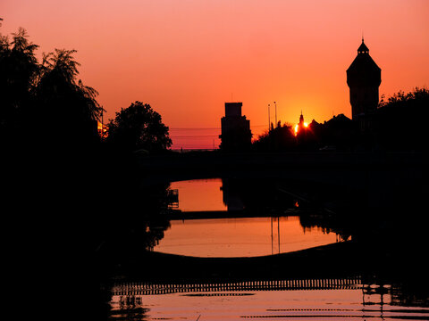 Red Bega River in Timisoara, Late skyline view in European City 
