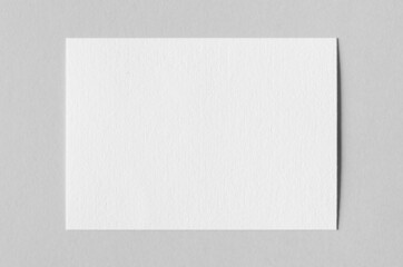 Textured A6 invitation card or flyer mockup, landscape orientation.