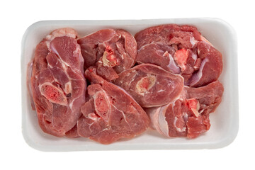 Holes bones of turkey in plastic container, slices of turkey legs in Food polystyrene tray isolated on white background. Top view