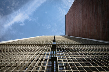 metal lattice brick wall and sky