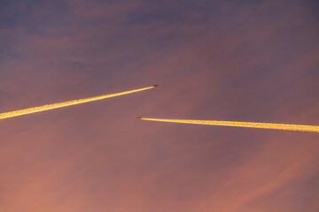 Airliner at high altitude with condesation trails