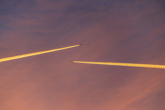 Airliner at high altitude with condesation trails