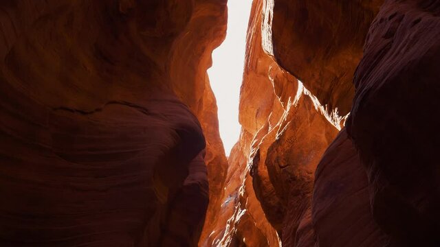 Mysterious Deep Slot Canyon With Curved And Smooth Orange Red Stone Cliffs Walls