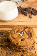 Organic food snack tasty sweet dessert milk dark chocolate chip salt cookie closeup piece fruit orange raspberry hazelnut nuts cinnamon on cocoa cacao powder wooden table for new year Christmas gift