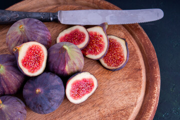 Organic Sweet fig fruit healthy vegan vegetable diet food fresh ripe red cut slide in half tasty...