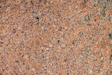 Textured surface of a granite slab in close-up. Background image