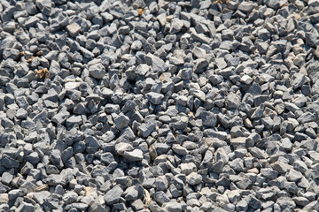 Gravel on the path. Gray stones. Gravel used in making th walk sidewalk
